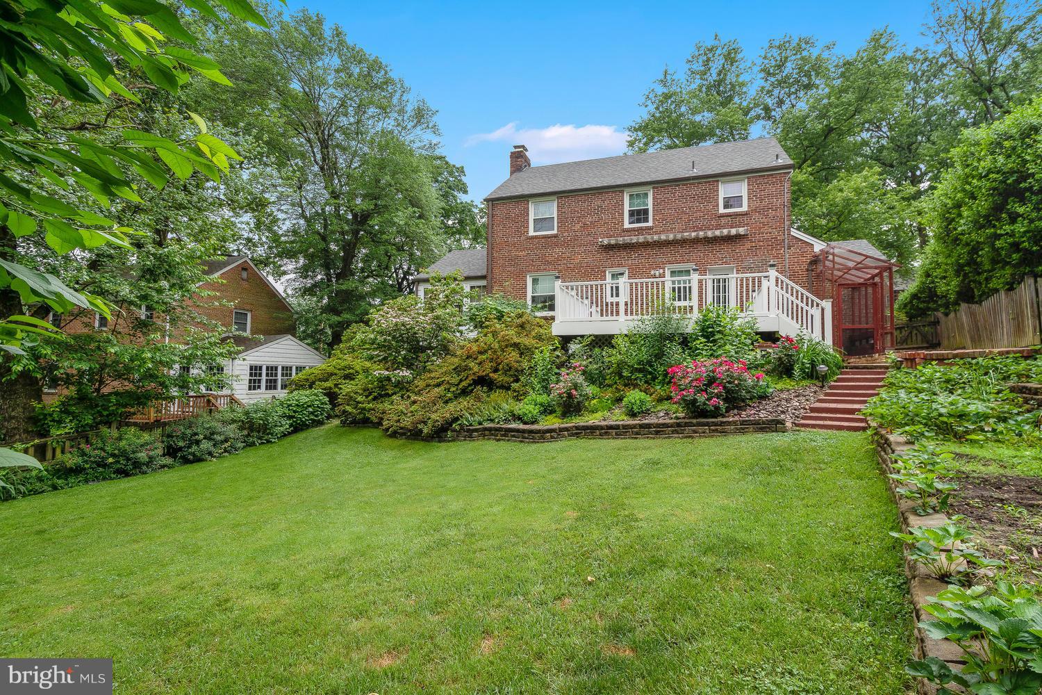 9505 St Andrews Way Silver Spring, MD 20901 - Photo 24 of 30 a front view of a house with garden