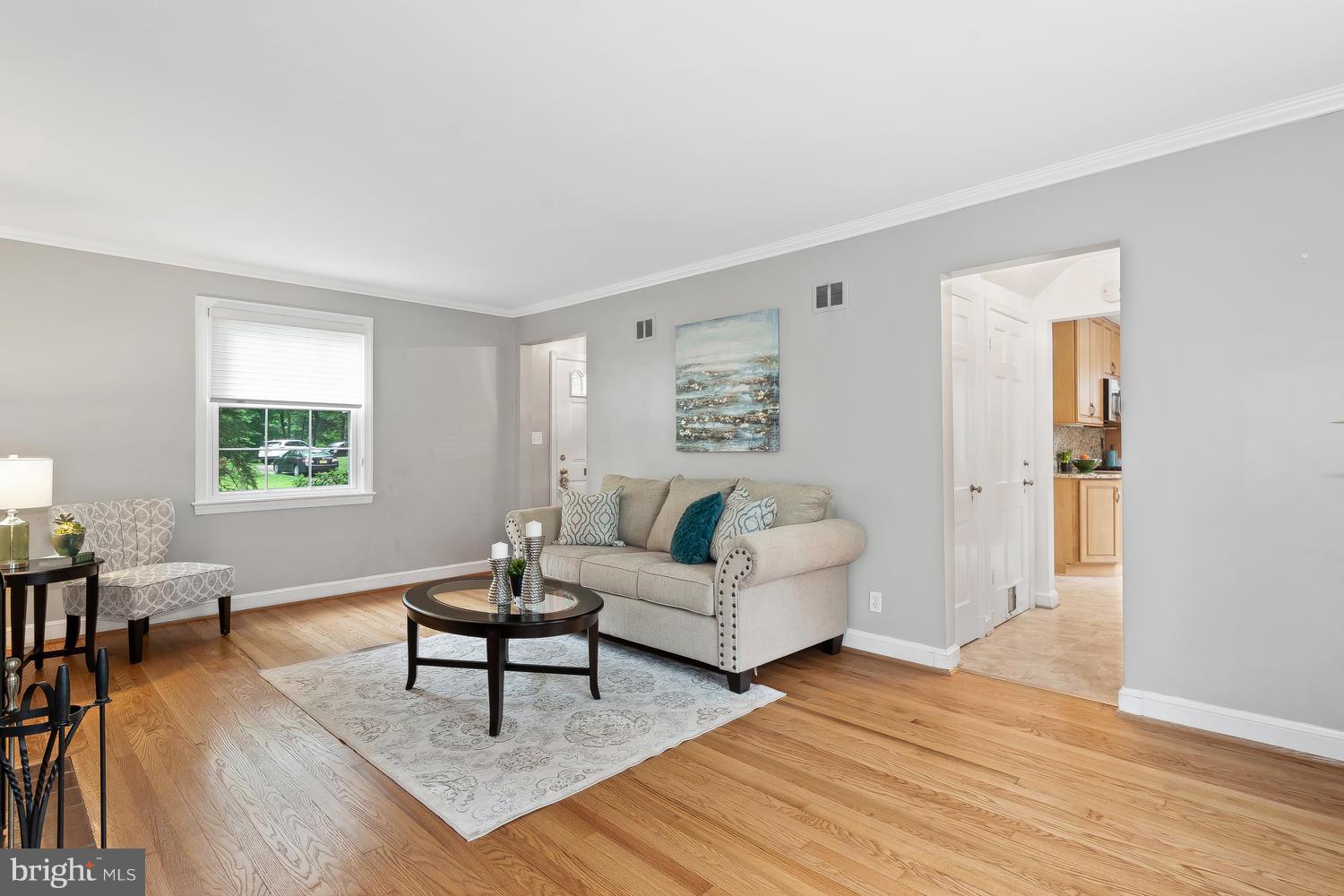 9505 St Andrews Way Silver Spring, MD 20901 - Photo 5 of 30 a living room with furniture and a wooden floor