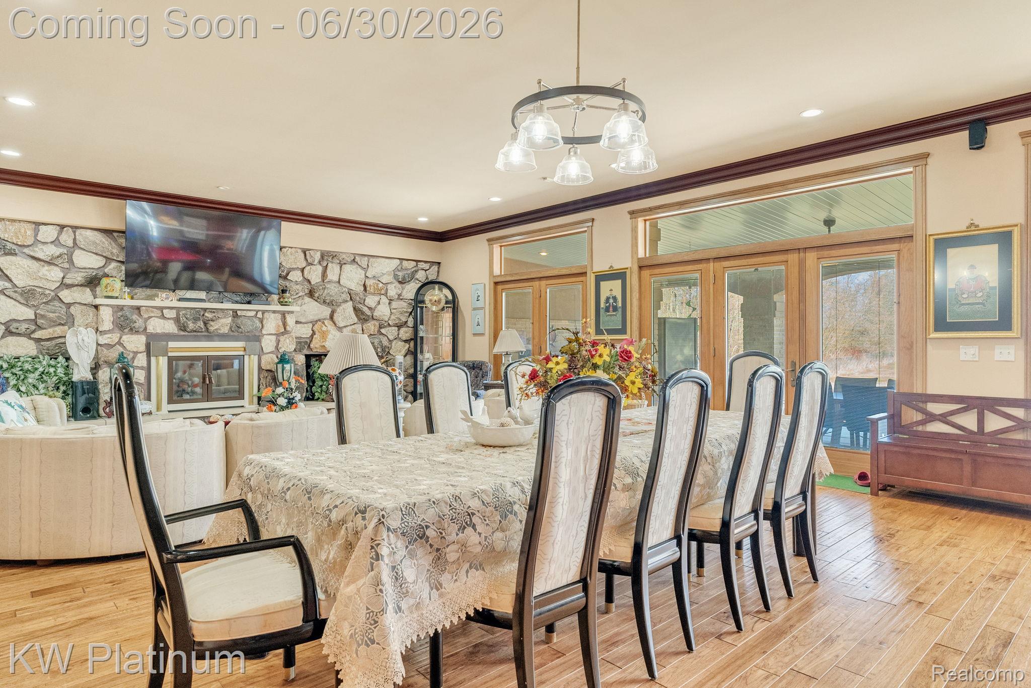 2235 South Lake Shore Road Harbor Beach, MI 48441 - Photo 19 of 99 Formal dining area featuring wood-finish flooring and a multi-light chandelier