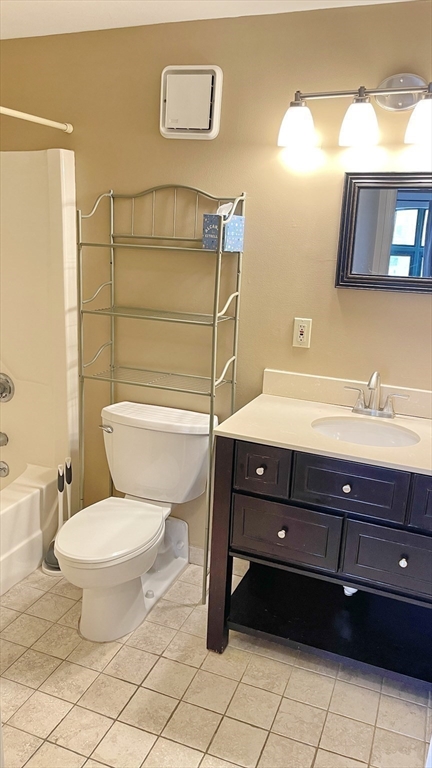 200 Market Street, Unit 505 Lowell, MA 01852 - Photo 22 of 22 a bathroom with a toilet a sink and mirror