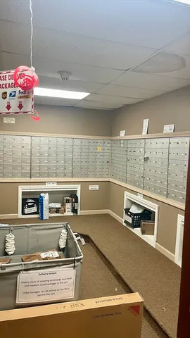 a view of an empty room with a fireplace