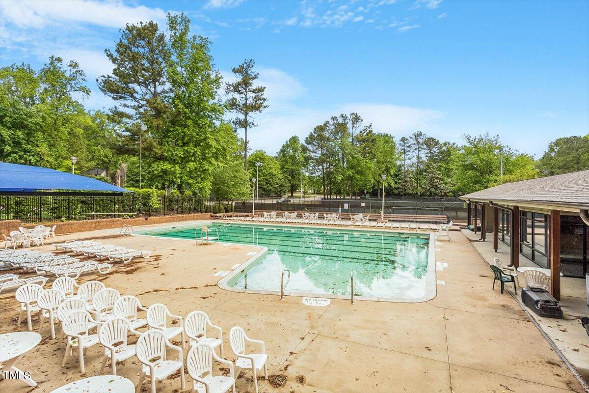 8617 Canoe Court Raleigh, NC 27615 - Photo 35 of 40 a view of a swimming pool with a yard