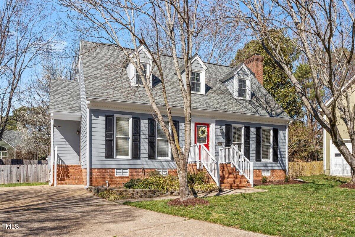 8617 Canoe Court Raleigh, NC 27615 - Photo 6 of 40 a front view of a house with a yard