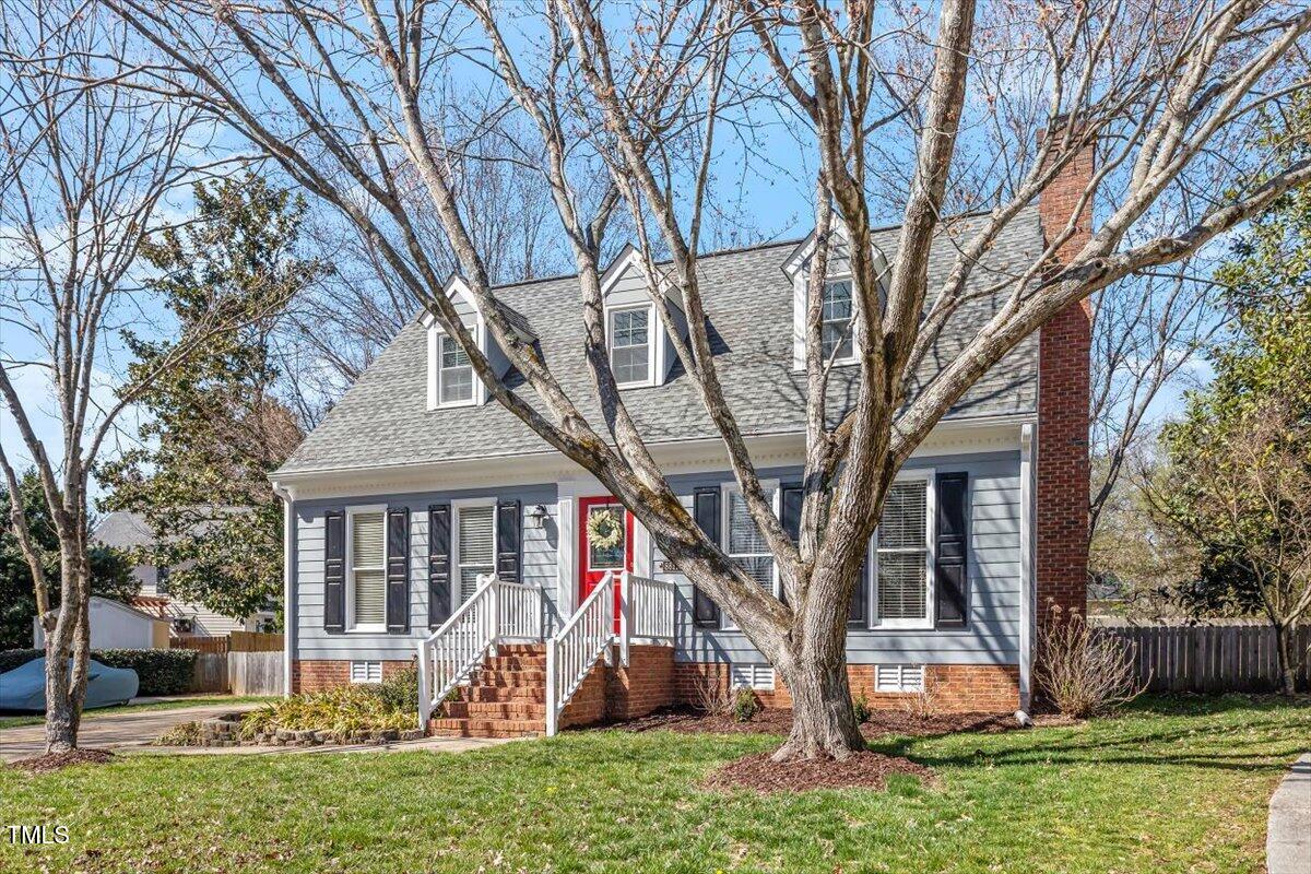 8617 Canoe Court Raleigh, NC 27615 - Photo 7 of 40 a front view of a house with garden