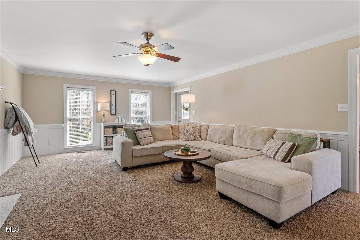 8617 Canoe Court Raleigh, NC 27615 - Photo 9 of 40 a living room with furniture and a large window