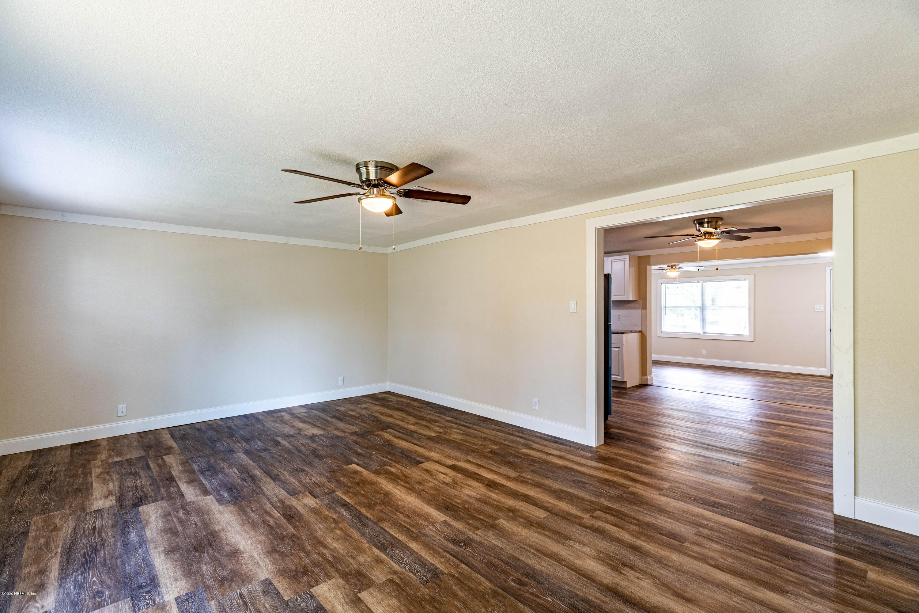 620 Southwest Field Avenue Keystone Heights, FL 32656 - Photo 19 of 68 a view of empty room with wooden floor and fan