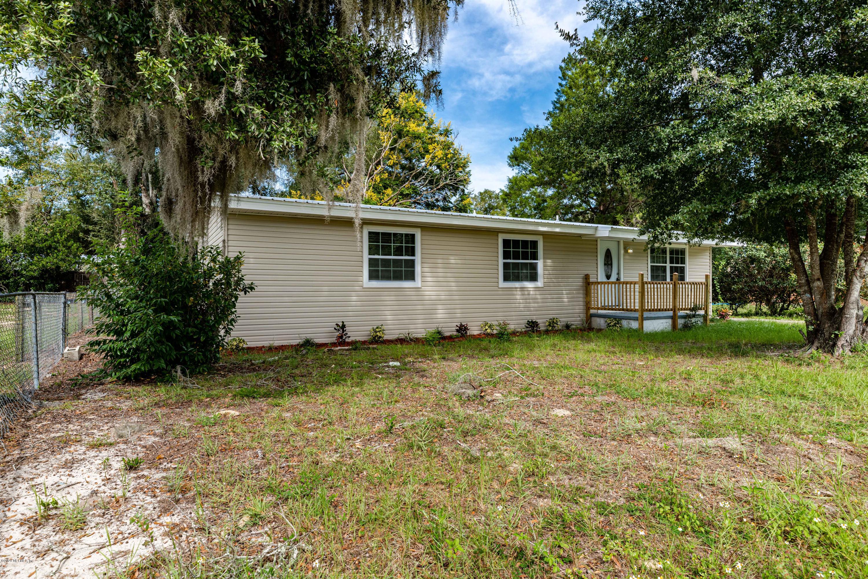 620 Southwest Field Avenue Keystone Heights, FL 32656 - Photo 2 of 68 a backyard of a house with yard and trampoline
