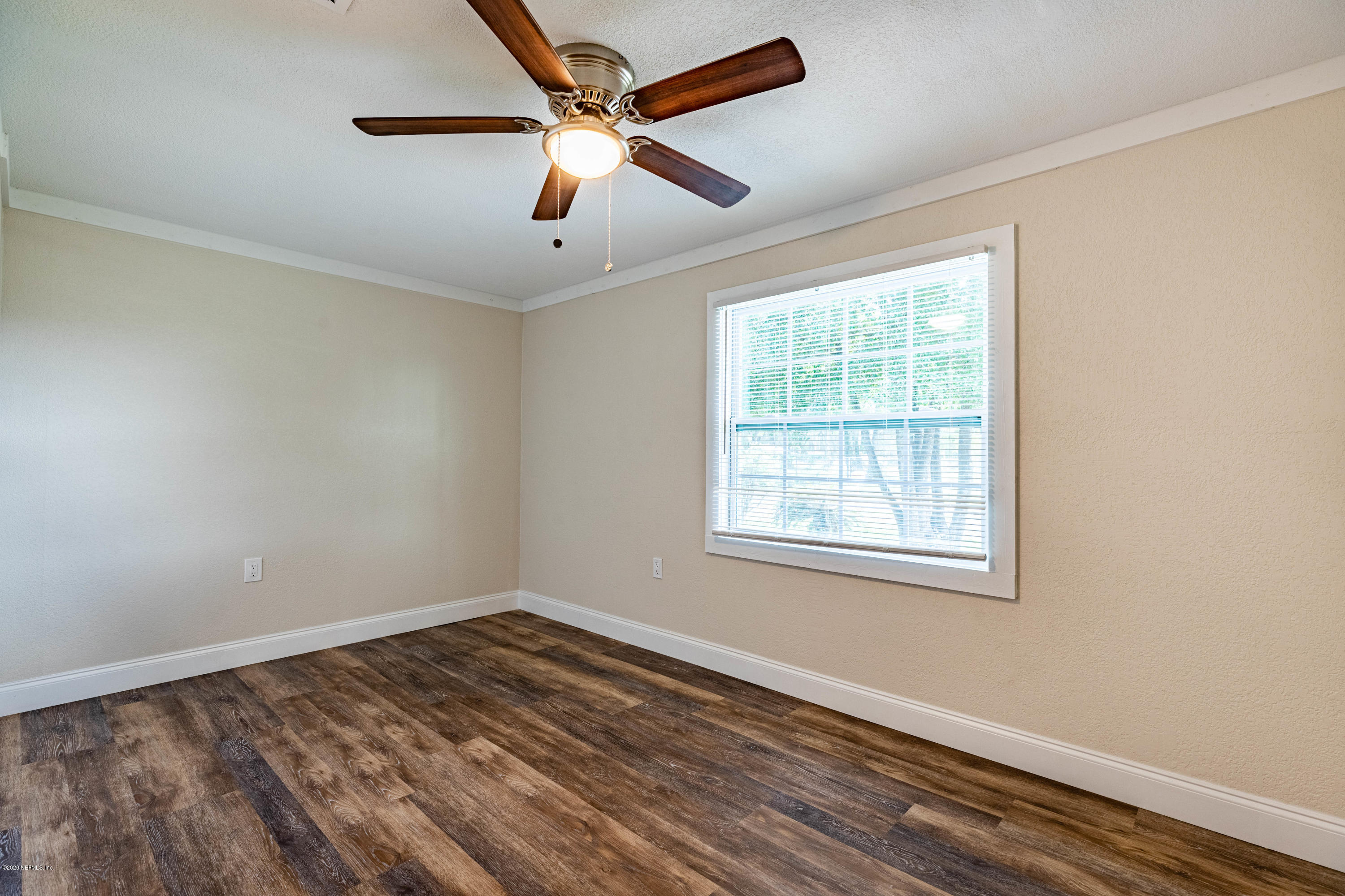 620 Southwest Field Avenue Keystone Heights, FL 32656 - Photo 31 of 68 wooden floor in an empty room with a window