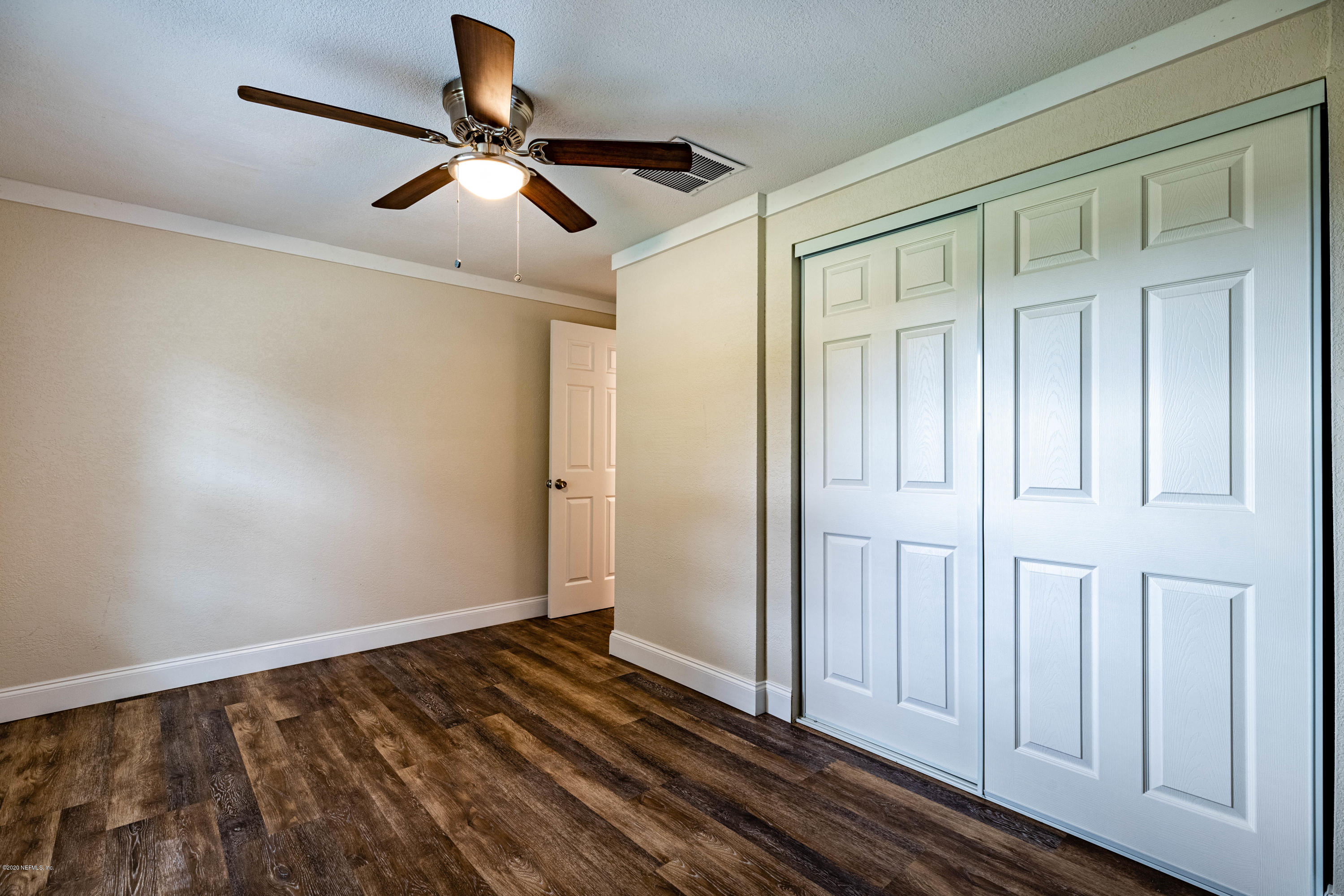 620 Southwest Field Avenue Keystone Heights, FL 32656 - Photo 32 of 68 a view of empty room with wooden floor
