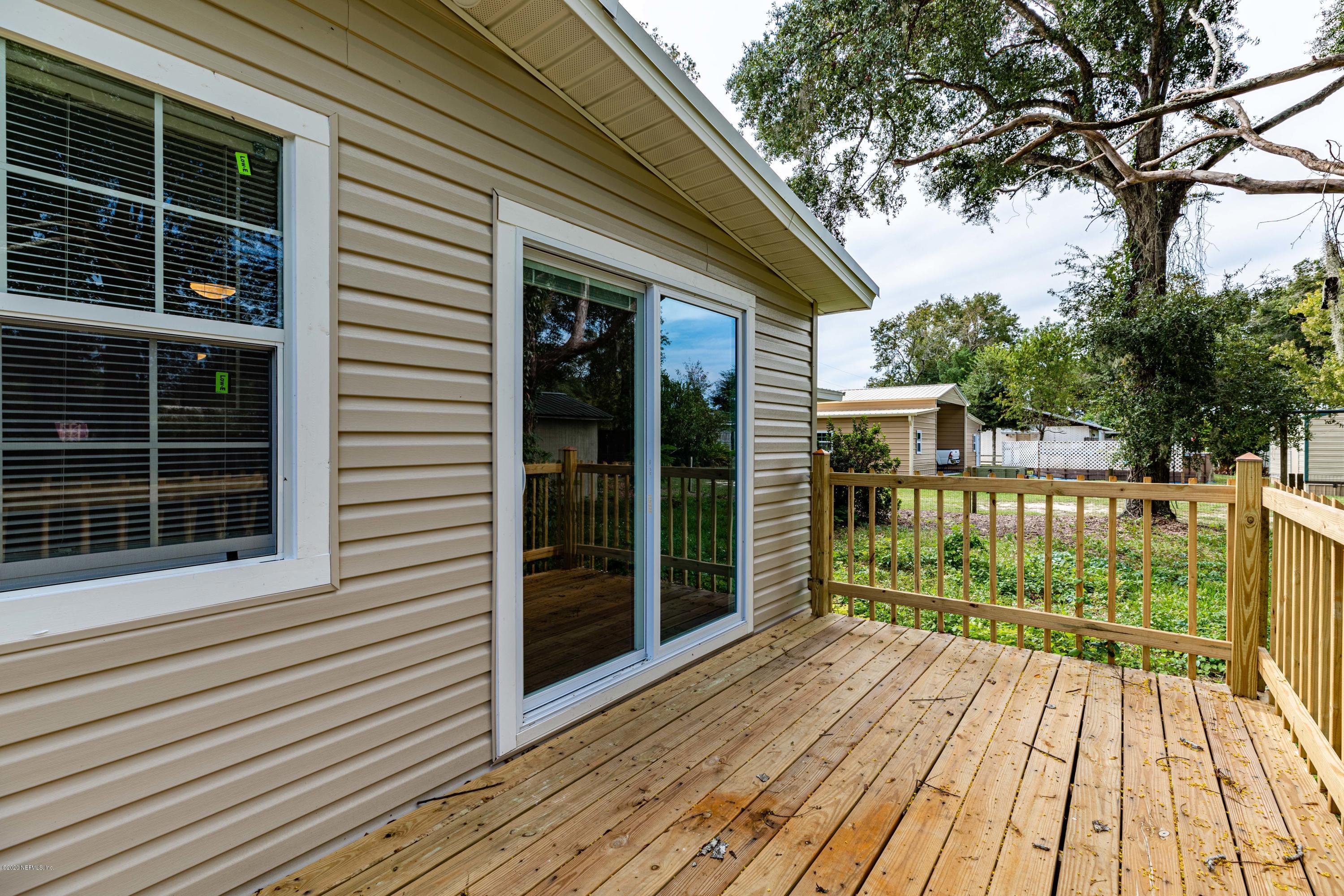 620 Southwest Field Avenue Keystone Heights, FL 32656 - Photo 34 of 68 a view of a house with a large window and wooden floor
