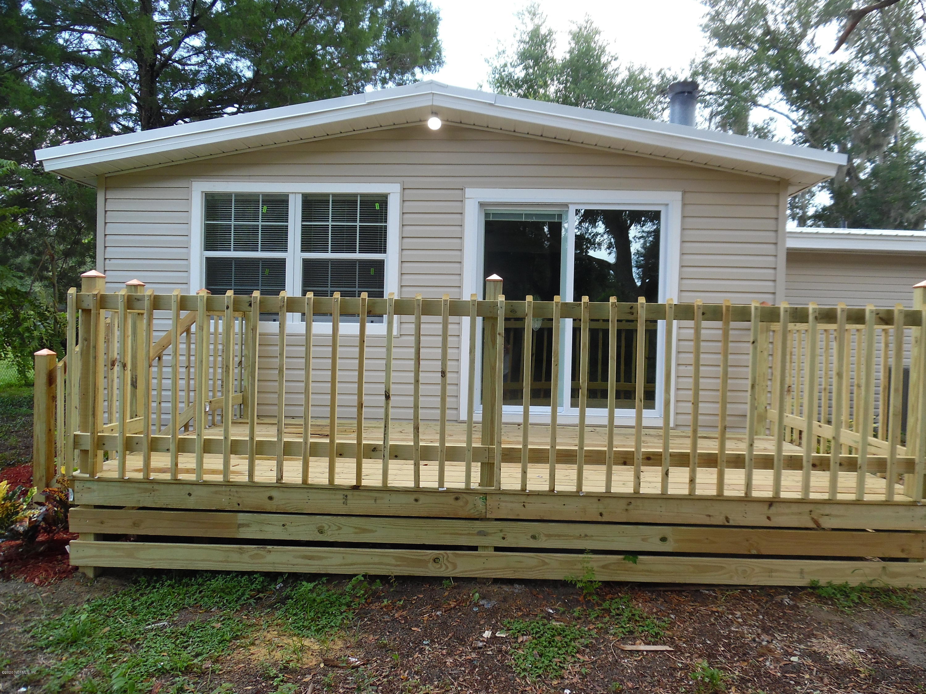 620 Southwest Field Avenue Keystone Heights, FL 32656 - Photo 39 of 68 a front view of a house with a yard