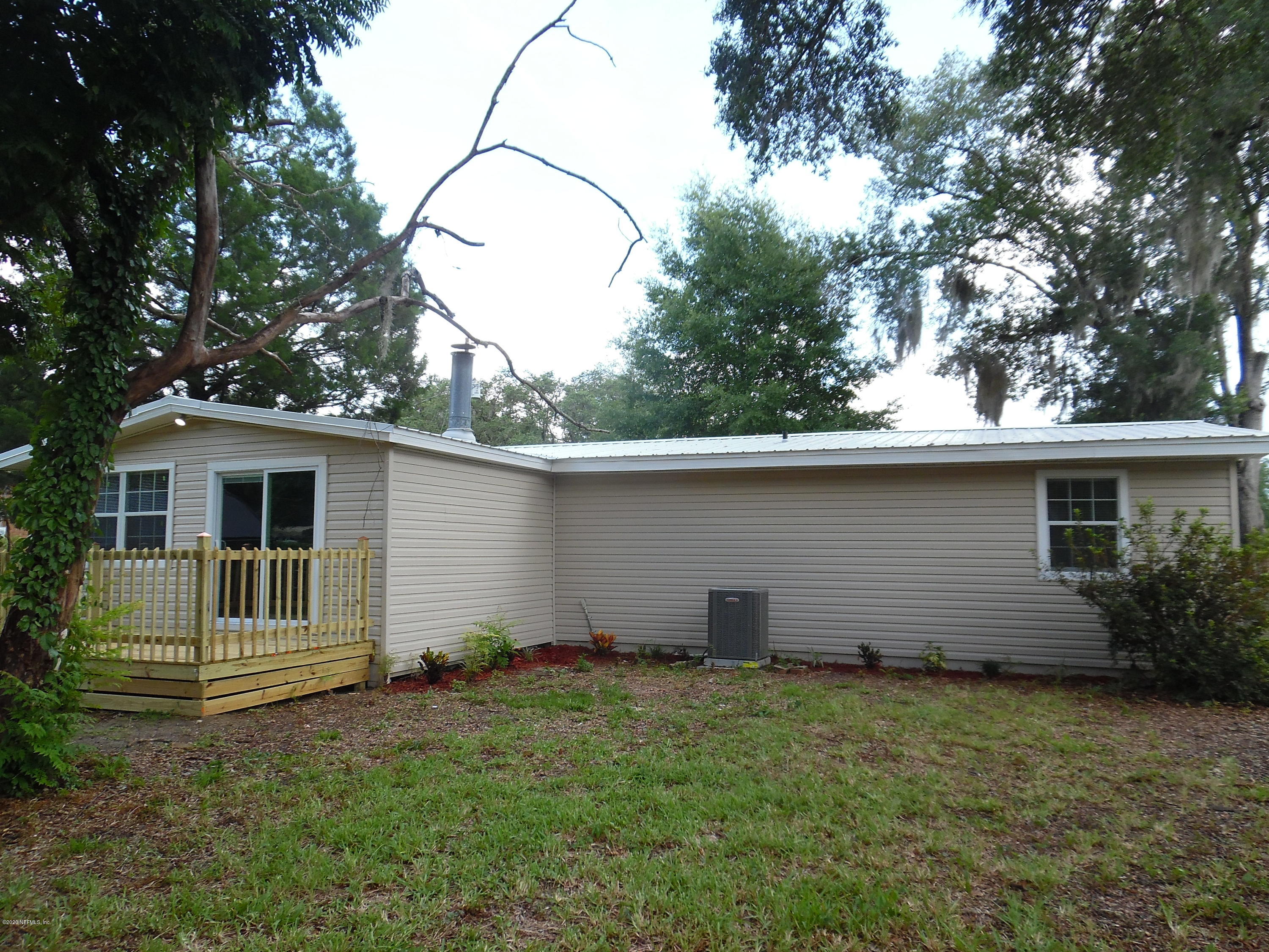 620 Southwest Field Avenue Keystone Heights, FL 32656 - Photo 59 of 68 a backyard of a house with lots of green space
