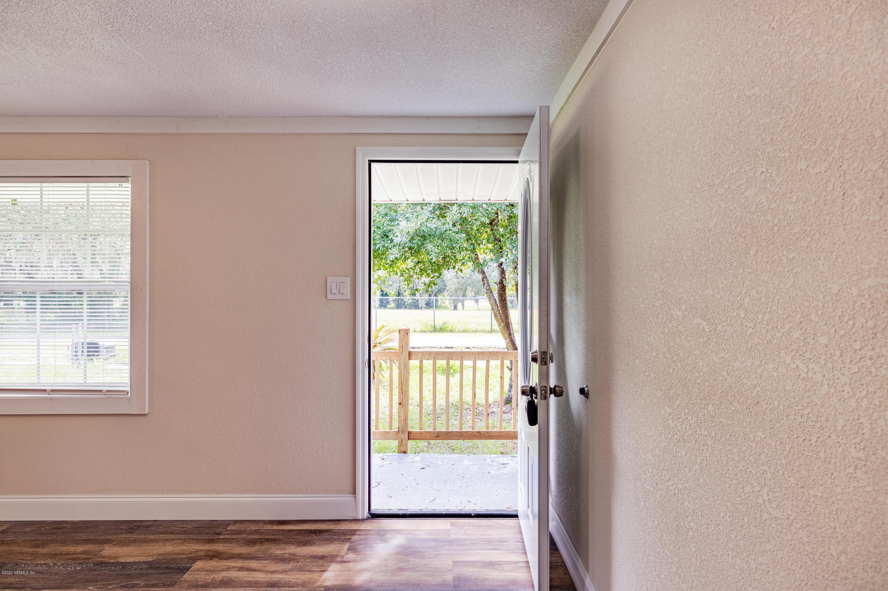 620 Southwest Field Avenue Keystone Heights, FL 32656 - Photo 10 of 68 a view of an empty room with a window