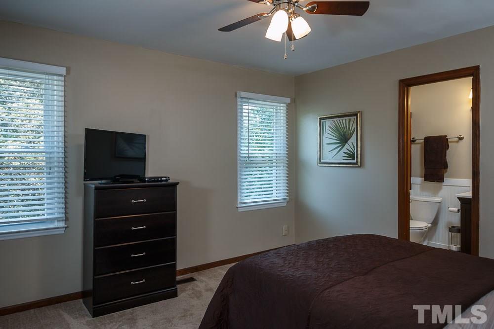 627 Bashford Road Raleigh, NC 27606 - Photo 12 of 25 Master bedroom with 2 closets, ceiling fan, and new carpet.