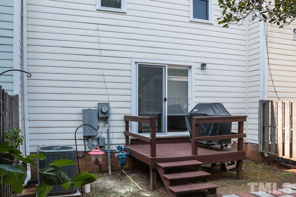 627 Bashford Road Raleigh, NC 27606 - Photo 22 of 25 Backyard with deck and storage shed.