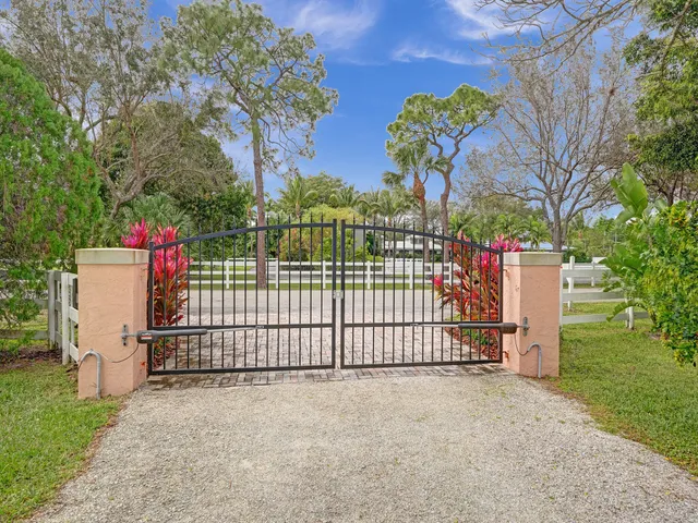 a view of a wrought iron fences in front of a house