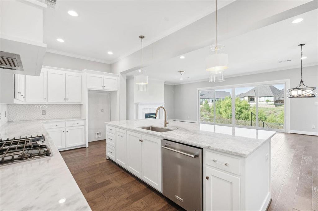 1920 Shumard Way Fort Worth, TX 76008 - Photo 11 of 38 a kitchen with a sink stove and cabinets