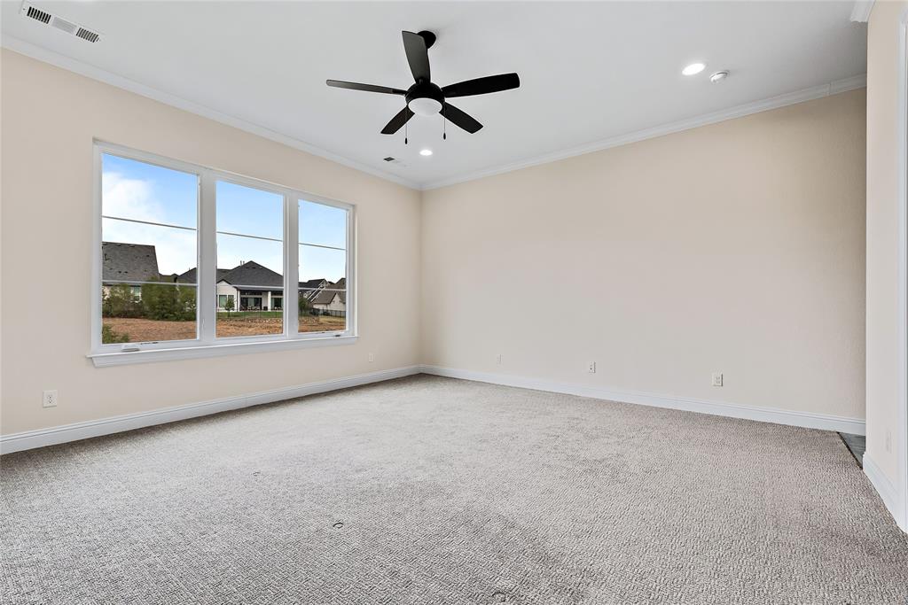1920 Shumard Way Fort Worth, TX 76008 - Photo 14 of 38 an empty room with windows and ceiling fan