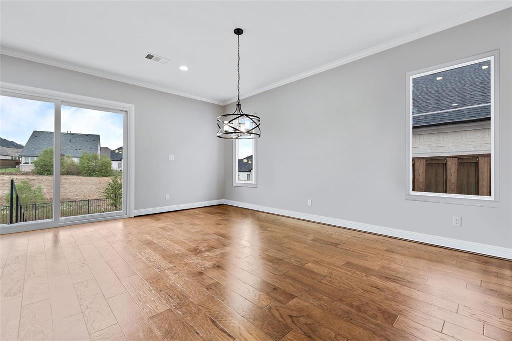 1920 Shumard Way Fort Worth, TX 76008 - Photo 8 of 38 a view of a room with wooden floor and a ceiling fan