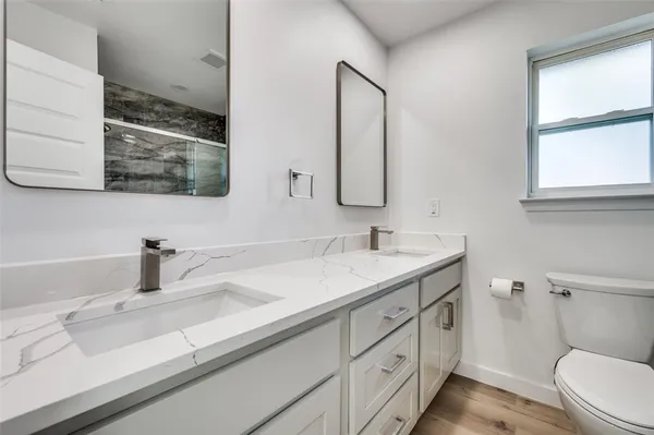 a bathroom with a sink and a toilet