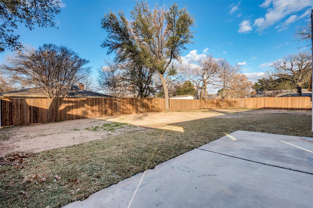 116 Cooper Drive Hurst, TX 76053 - Photo 22 of 25 a view of dirt yard with a large tree