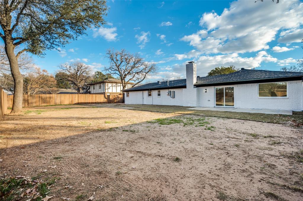 116 Cooper Drive Hurst, TX 76053 - Photo 24 of 25 a view of a yard with a house