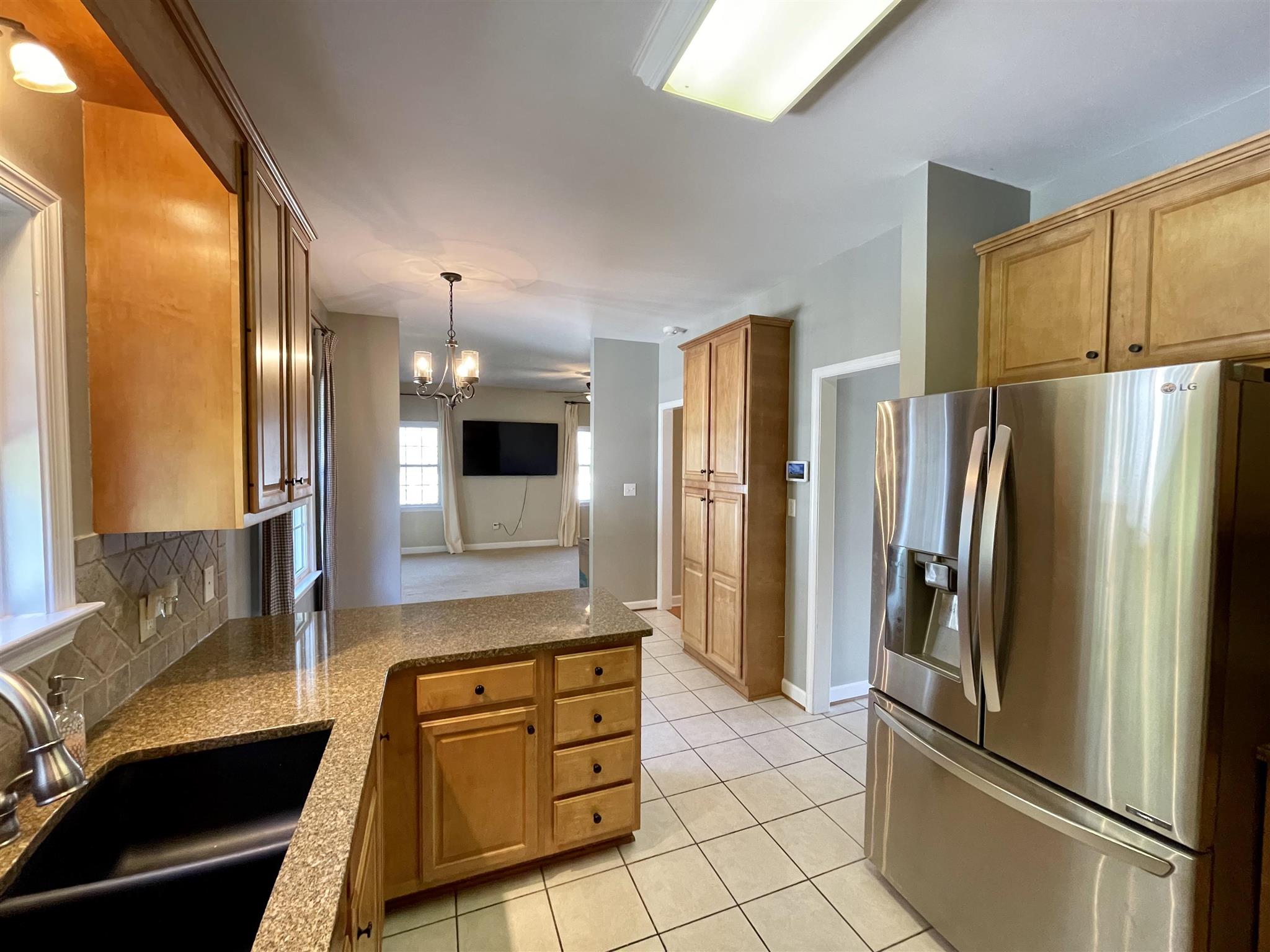 109 Long Bow Road Waynesboro, VA 22980 - Photo 12 of 42 a kitchen with stainless steel appliances granite countertop a refrigerator and a stove