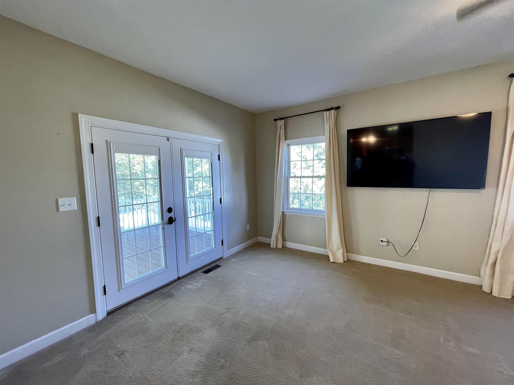 109 Long Bow Road Waynesboro, VA 22980 - Photo 15 of 42 an empty room with windows cabinet and mirror
