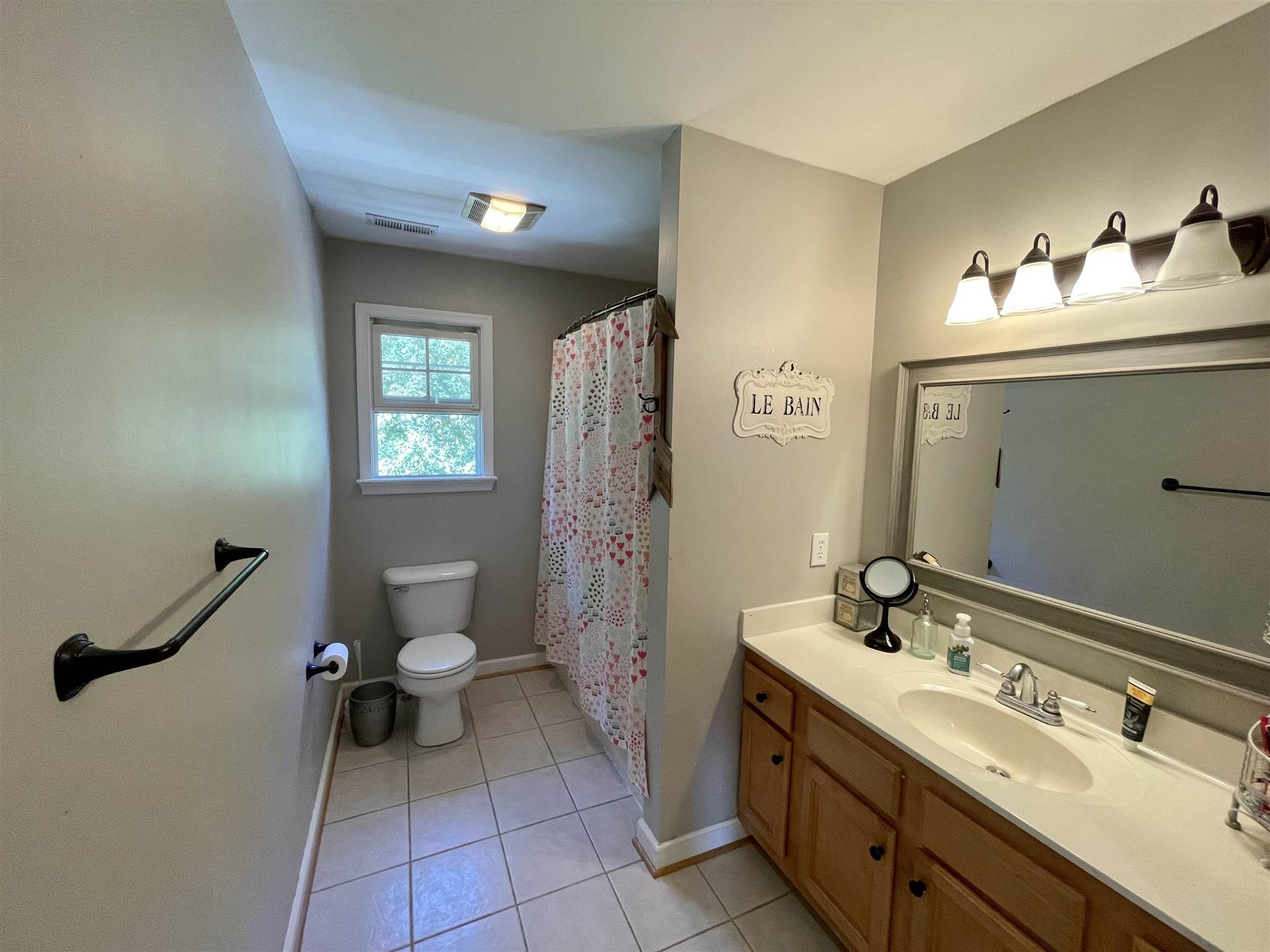 109 Long Bow Road Waynesboro, VA 22980 - Photo 27 of 42 a spacious bathroom with a double vanity sink toilet and a mirror