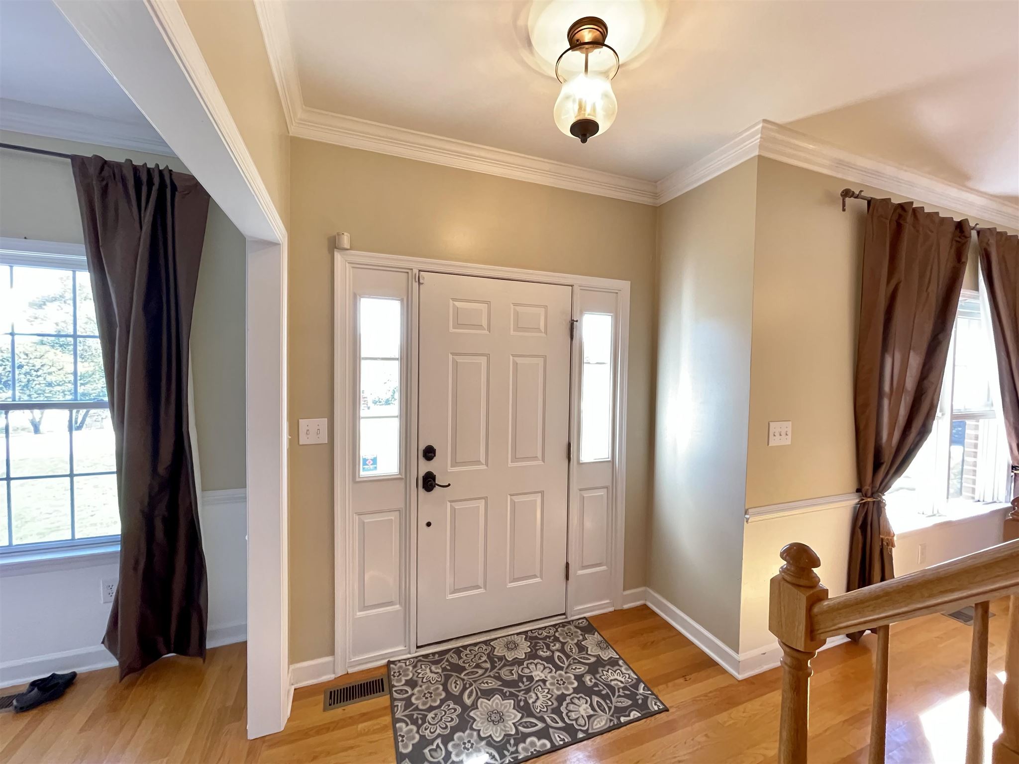 109 Long Bow Road Waynesboro, VA 22980 - Photo 5 of 42 a view of a hallway with wooden floor and staircase