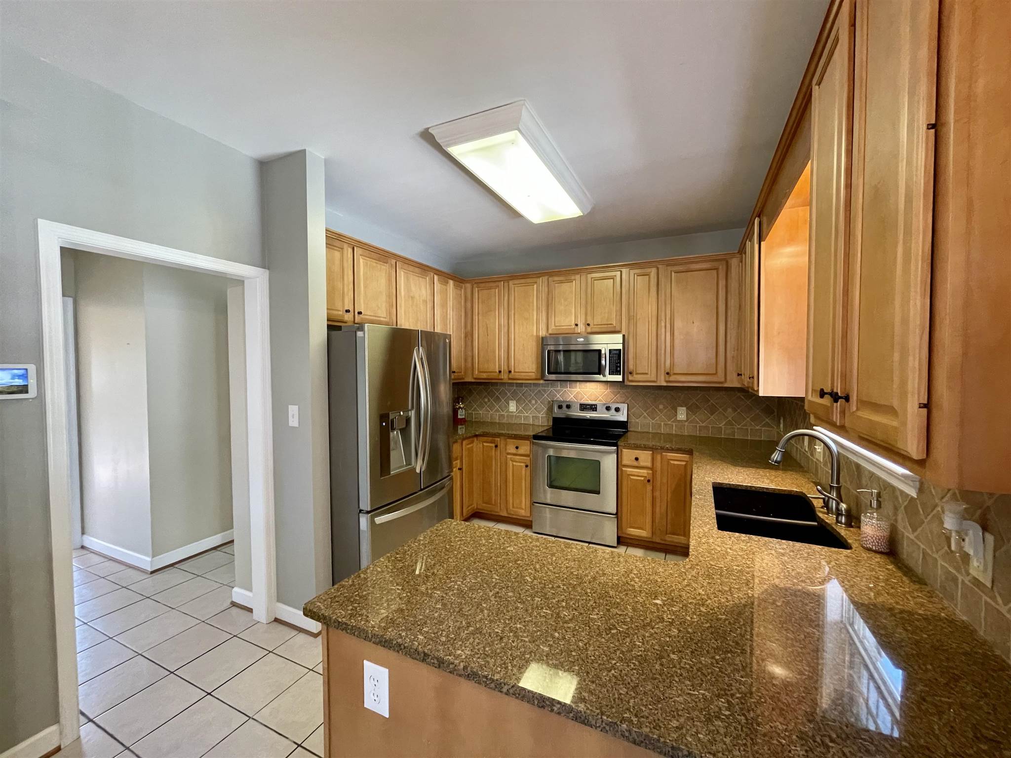 109 Long Bow Road Waynesboro, VA 22980 - Photo 10 of 42 a kitchen with granite countertop a refrigerator and sink