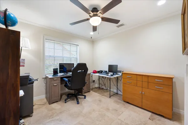 a bathroom with a granite countertop sink a toilet and a mirror