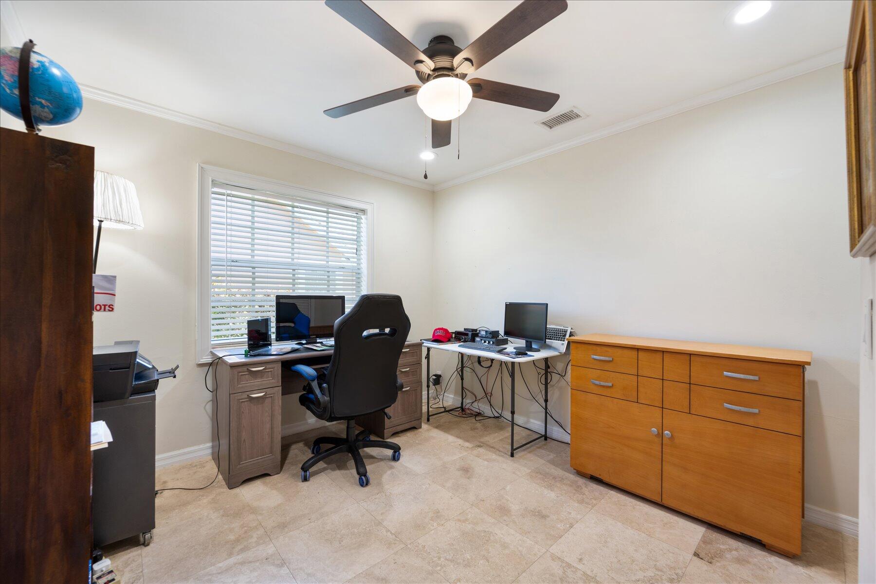 13889 Geranium Place Wellington, FL 33414 - Photo 20 of 32 a view of workspace with wooden floor windows