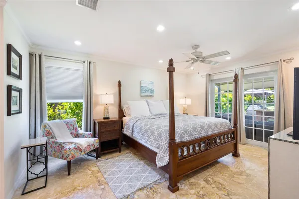 a bedroom with a bed and flat screen tv