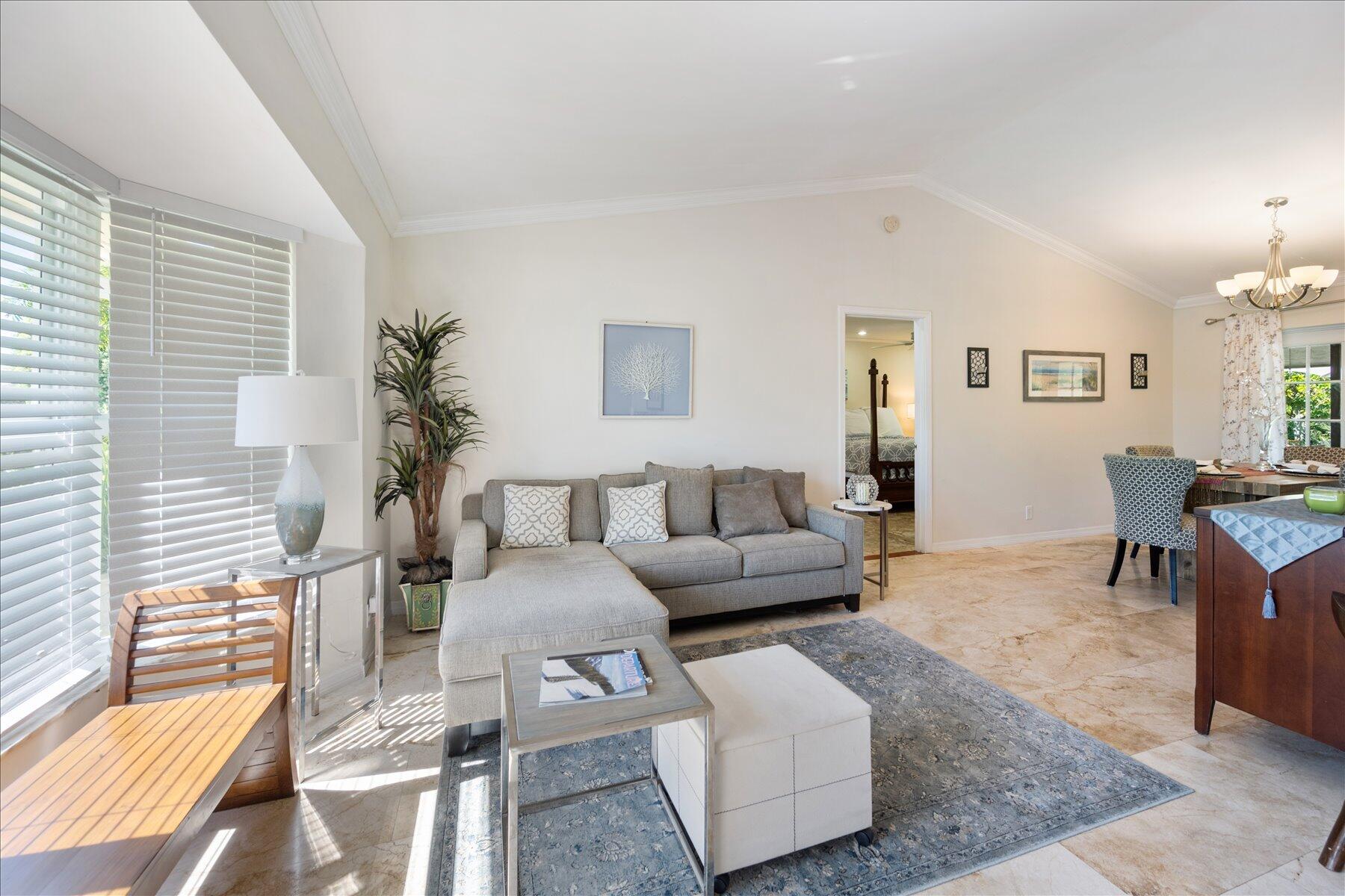 13889 Geranium Place Wellington, FL 33414 - Photo 5 of 32 a living room with furniture and a potted plant