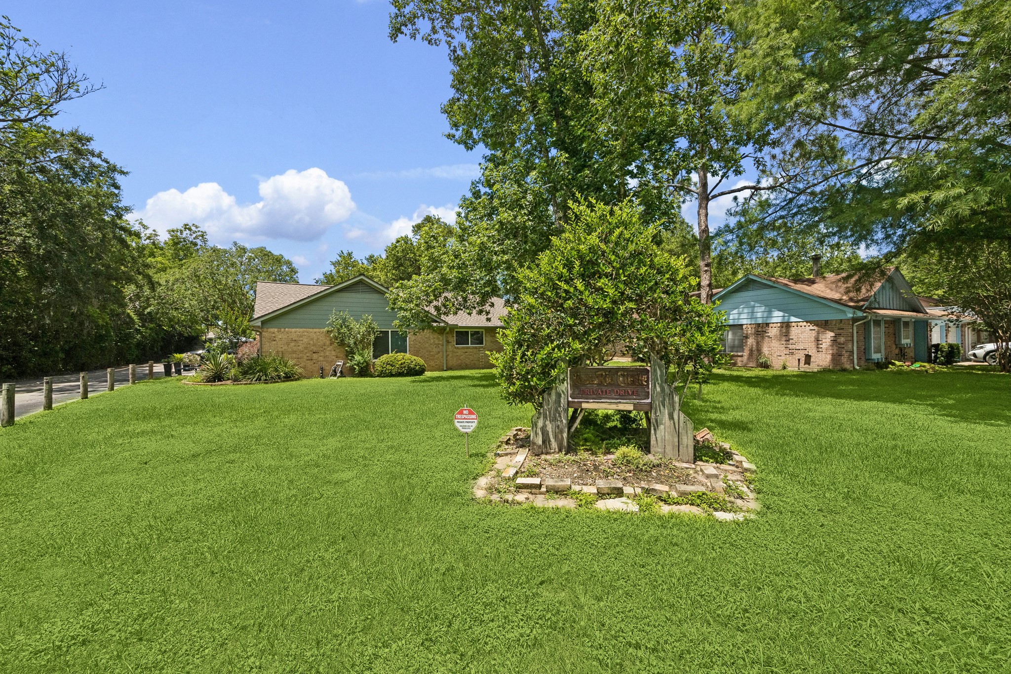 2102 Casa Rio Circle Dickinson, TX 77539 - Photo 3 of 22 A rare condominium setting with room to breathe. The beautifully maintained grounds surrounding Casa Rio create a peaceful, park-like environment, while the home's location beside a large open green space provides enhanced privacy, scenic views, and a distinctive single-family-home feel within this waterfront community. ***Bonus ~ No neighbors to the right of the home***