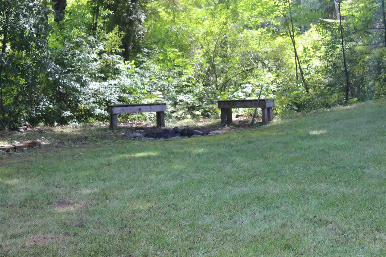 3385 Mertz Road Caro, MI 48723 - Photo 4 of 22 The yard even features a firepit with benches