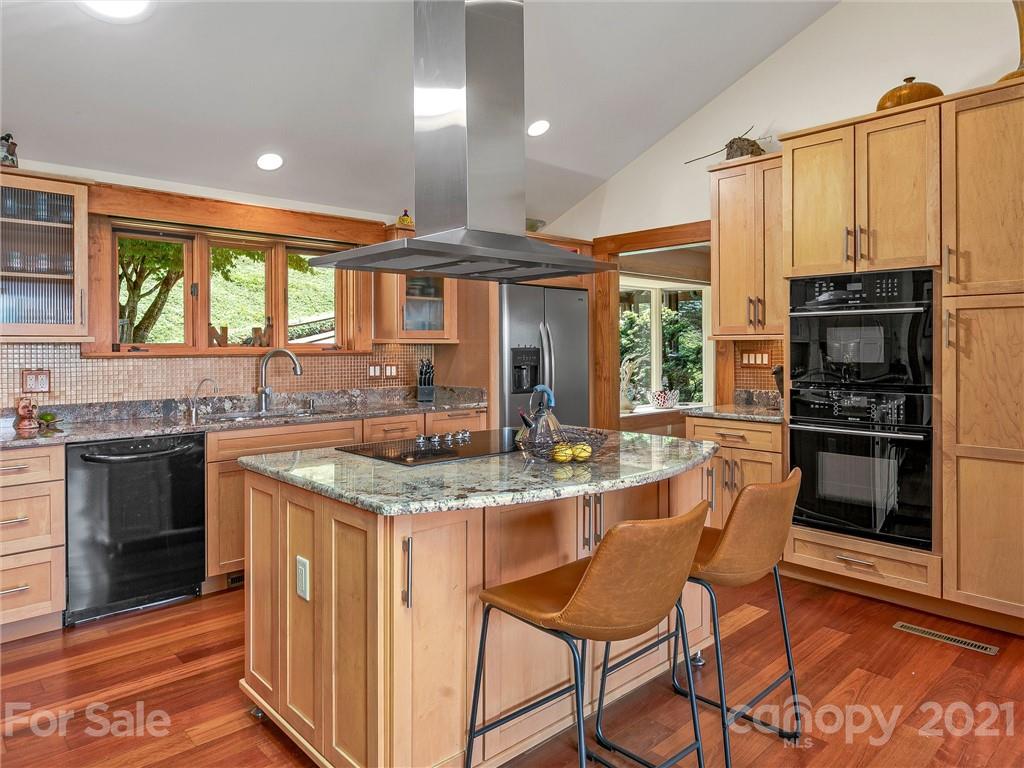 22 Sunset Summit Asheville, NC 28804 - Photo 11 of 42 a kitchen with stainless steel appliances granite countertop a stove and a refrigerator