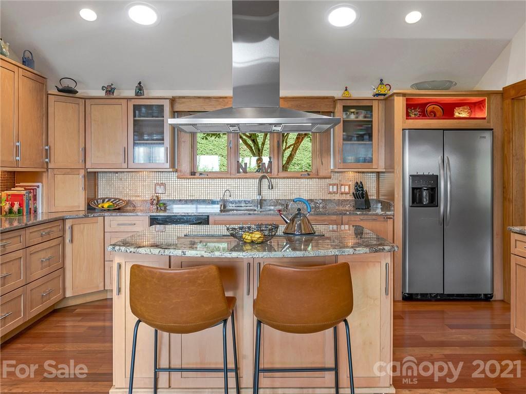 22 Sunset Summit Asheville, NC 28804 - Photo 13 of 42 a kitchen with stainless steel appliances granite countertop a sink and a refrigerator