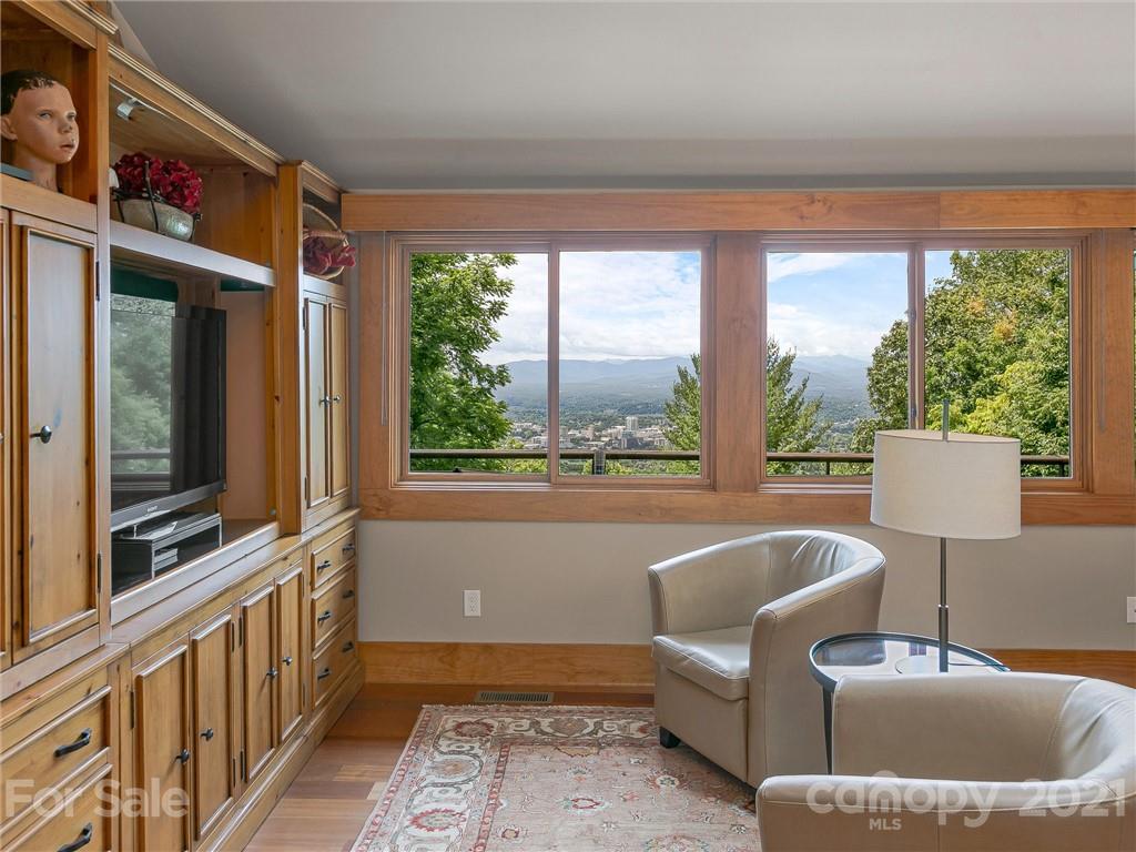 22 Sunset Summit Asheville, NC 28804 - Photo 16 of 42 a living room with furniture and a window