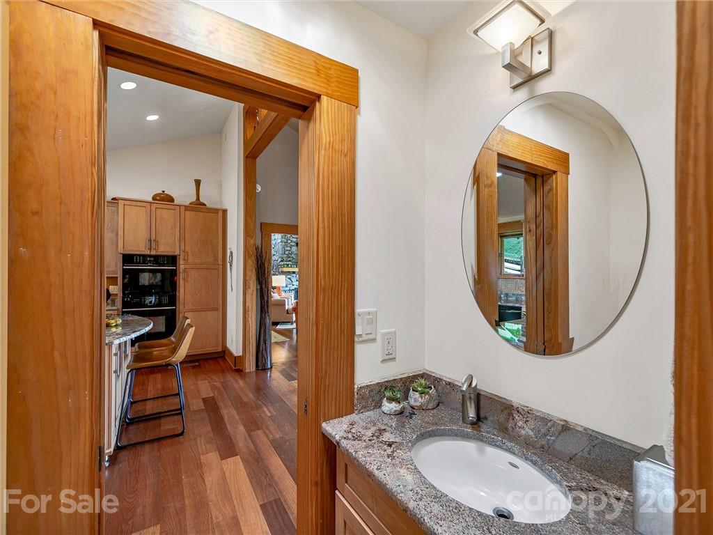 22 Sunset Summit Asheville, NC 28804 - Photo 17 of 42 a bathroom with a sink and a mirror