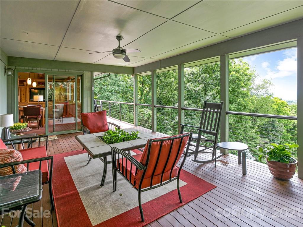 22 Sunset Summit Asheville, NC 28804 - Photo 18 of 42 a view of a dining room with furniture window and wooden floor