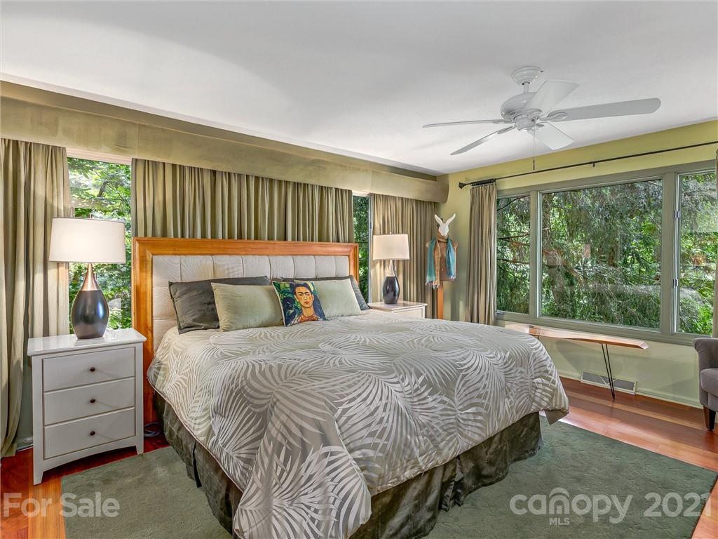 22 Sunset Summit Asheville, NC 28804 - Photo 20 of 42 a bedroom with a large bed and a large window
