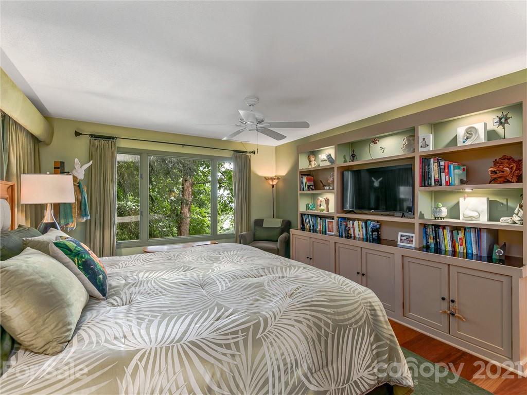 22 Sunset Summit Asheville, NC 28804 - Photo 21 of 42 a large bedroom with a large bed and a large window