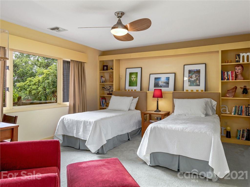 22 Sunset Summit Asheville, NC 28804 - Photo 26 of 42 a bedroom with two beds and a book shelf