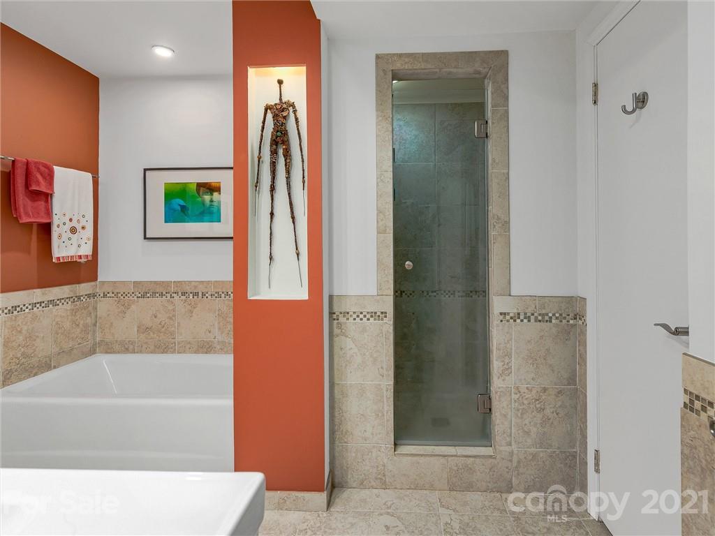 22 Sunset Summit Asheville, NC 28804 - Photo 27 of 42 a bathroom with a bathtub and a shower