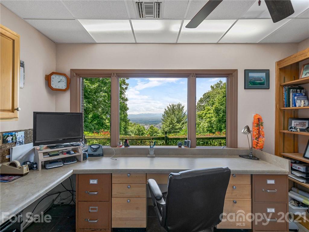 22 Sunset Summit Asheville, NC 28804 - Photo 30 of 42 a livingroom with workspace window and a couch