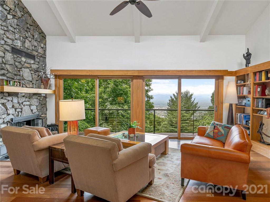 22 Sunset Summit Asheville, NC 28804 - Photo 4 of 42 a living room with fireplace furniture and a large window