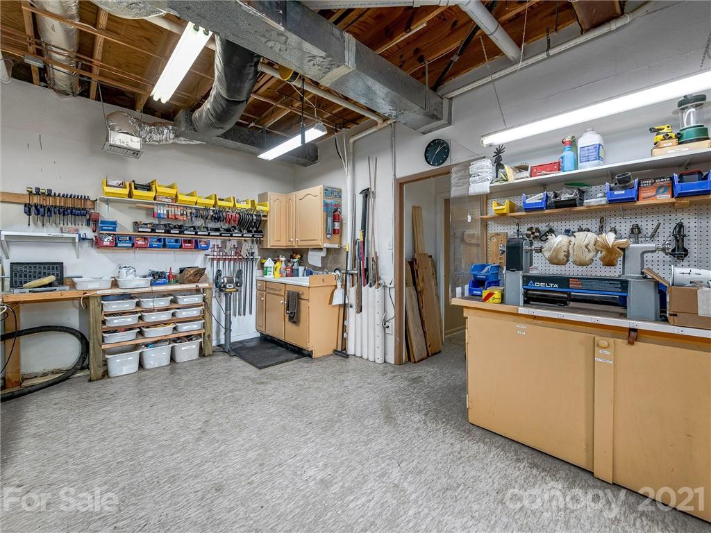 22 Sunset Summit Asheville, NC 28804 - Photo 31 of 42 a view of storage and utility room with racks a book shelf