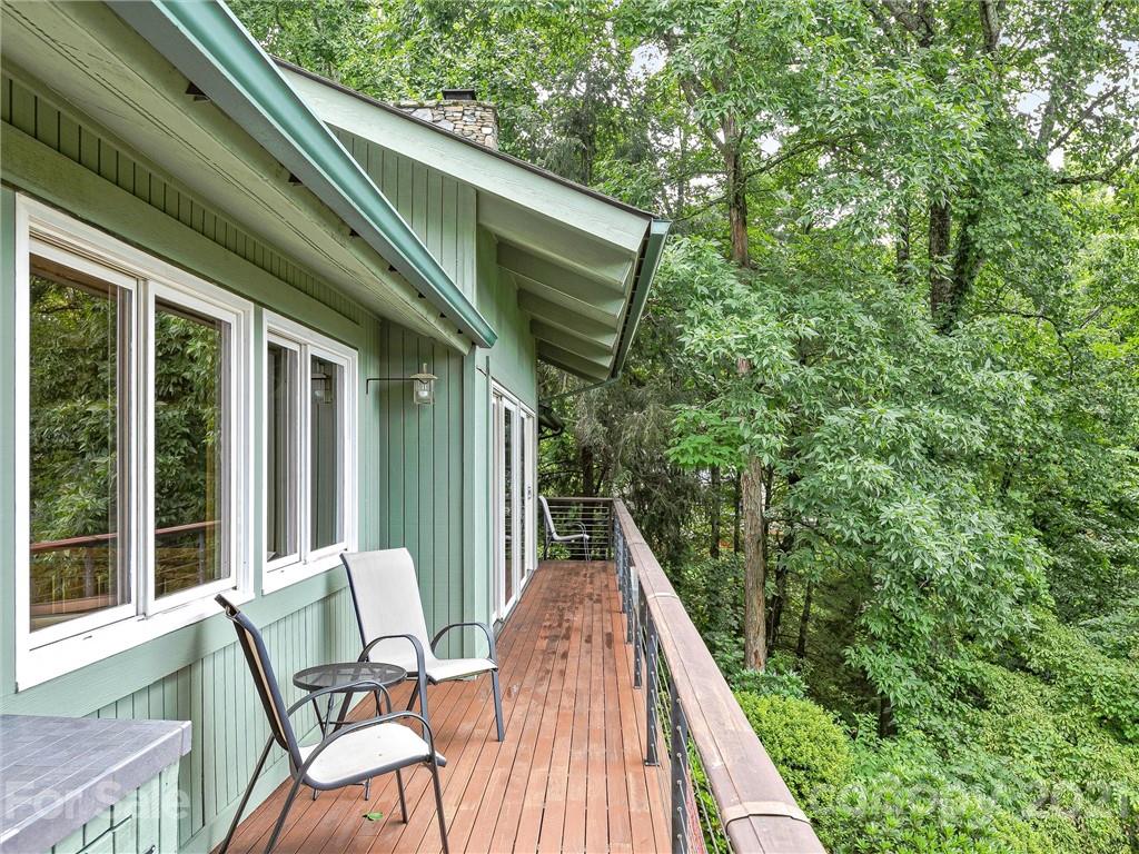22 Sunset Summit Asheville, NC 28804 - Photo 39 of 42 a view of a chair and tables in the balcony